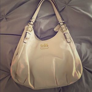 Coach beige purse with red inside